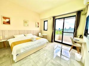 Postel nebo postele na pokoji v ubytování 睡飽飽民宿 Sleeping Well B&B 全新電梯民宿