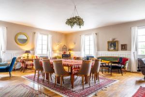 a dining room with a table and chairs at Family Hotel Okoř in Okoř