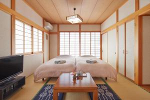 Een bed of bedden in een kamer bij Ichigo Ichie Nikko - Vacation STAY 09411v