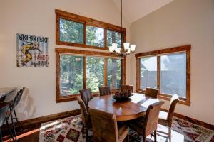 a dining room with a wooden table and chairs at North Shore Bliss by Tahoe Getaways - 3 BR plus loft & Private Hot Tub in Carnelian Bay +10 photos