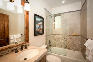 a bathroom with a sink and a toilet and a tub at North Shore Bliss by Tahoe Getaways - 3 BR plus loft & Private Hot Tub in Carnelian Bay