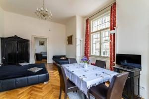 a living room with a table and a couch at Cosy Apartment for 4 / Old Town / Jewish Quarter in Prague