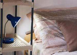 Postel nebo postele na pokoji v ubytování A casa di Donnie-Iglesias centro