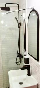 a bathroom with a sink and a mirror at Casa NOR in Tarcău-Gheuca +40 photos