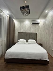 Ένα ή περισσότερα κρεβάτια σε δωμάτιο στο Hello Dushanbe Hostel