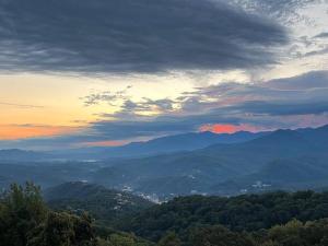 a view of a valley with mountains in the distance at Comfy Condo With Amazing View of Gatlinburg and the Smokies in Gatlinburg