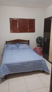 Ένα ή περισσότερα κρεβάτια σε δωμάτιο στο Bela casa de Veraneio - faça sua reserva.