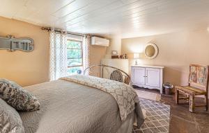 a bedroom with a bed and a window at Pet Friendly Piñon Heaven in Santa Fe