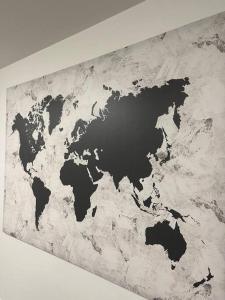 a map of the world on a wall at Classy single family house, walk to St Boniface in Winnipeg
