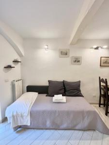 a bedroom with a bed with a towel on it at ADG Apartment 33 in Florence