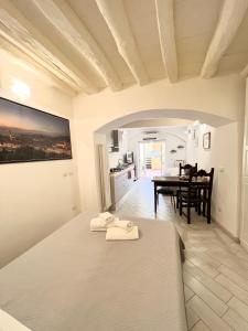 a white room with a table and a dining room at ADG Apartment 33 in Florence