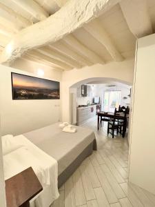 a bedroom with a bed and a dining room at ADG Apartment 33 in Florence