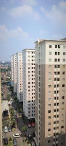 an aerial view of a city with tall buildings at Papilukas Room Kalibata City - Studio Gold in Jakarta