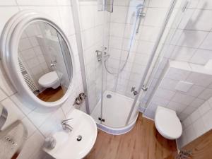 a bathroom with a shower and a sink and a mirror at Mosel View in Zell an der Mosel