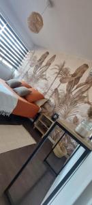a bedroom with a bird mural on the wall at Chez Alexandra in Montpellier +21 photos