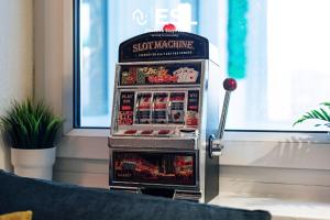 a soda vending machine sitting in a room at 3 bedroom House - Next to Wrexham FC Racecourse Stadium in Wrexham
