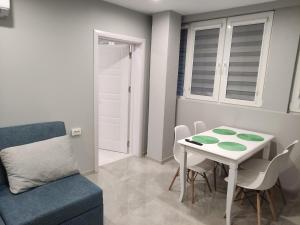a living room with a table and a chair at Uptown Funk in Ruse