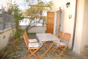 a table and chairs sitting on a patio at Casetta a Pescasseroli in Pescasseroli