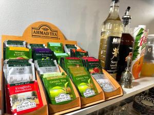 a shelf with a bunch of differentiatesiatesiatesiatesiatesktop at Bobosh Boutique in Bukhara +88 photos