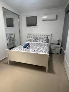 Palmas View Premium 7 tesisinde bir odada yatak veya yataklar