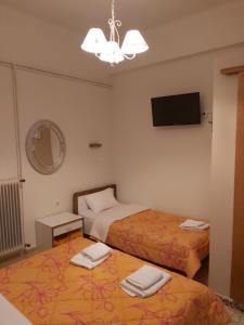 Postel nebo postele na pokoji v ubytování Ermis Hotel