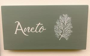 a chalkboard with the word analoria and a plant at Agrestia azienda agricola in Bertinoro