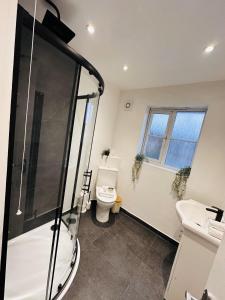 a bathroom with a shower and a toilet at R1 - En-suite Private Room in Birmingham House - Quinton in Birmingham +15 photos