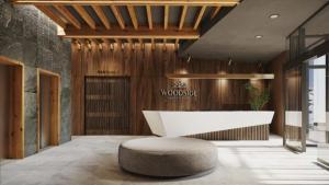 a lobby with a white table and a round stool at Woodside Kopaonik By Gogic in Kopaonik