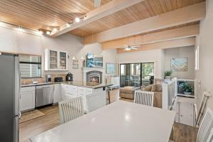 a kitchen and living room with a table and chairs at The perfect Forest Pines getaway in Incline Village