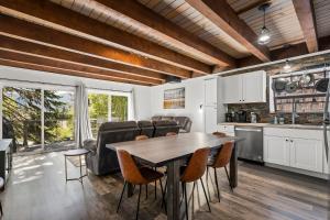 a kitchen and dining room with a table and chairs at Incline Village Championship Golf Coarse Retreat in Incline Village +19 photos