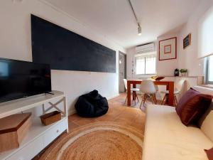 Televízia a/alebo spoločenská miestnosť v ubytovaní Casa Mencía