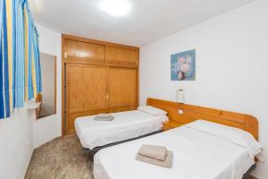 Posteľ alebo postele v izbe v ubytovaní Apartamento El Cardenal playa de Cura Mogán + 37 fotografií