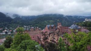 an old building sitting on top of a mountain at Burgfreiheit in Heidelberg