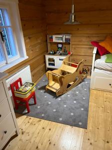 a room with a bedroom with a bed and a kitchen at Roubenka Bratrouchov in Jablonec nad Jizerou +28 photos