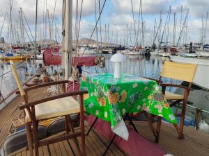 a table and chairs on a boat in a marina at 1983 in Las Palmas de Gran Canaria