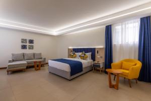 Postel nebo postele na pokoji v ubytování Premium Inn Mombasa City + 34 fotografií