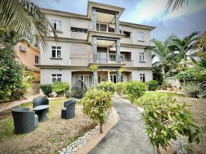 an apartment building with a walkway in front of it at Pebble Bay Garden View F3 in Grand-Baie