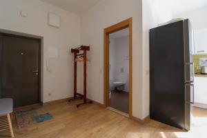 a room with a bathroom with a toilet and a mirror at Great Amber Apartment in Liepāja +5 photos