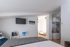 Postel nebo postele na pokoji v ubytování Bisu Isola di Sant'Antioco