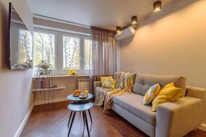 a living room with a couch and a table at Rent like home - Bruna 2 in Warsaw