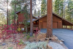 a house in the middle of a forest at 451 First Green Dr - Mountain Home in Incline Village