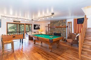 a living room with a pool table in it at 451 First Green Dr - Mountain Home in Incline Village