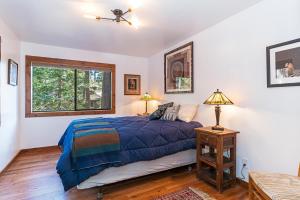 a bedroom with a bed and a window at 451 First Green Dr - Mountain Home in Incline Village