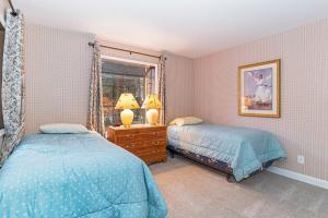 a bedroom with two beds and a window at 47 McCloud - Upper Unit 3 Bedrooms in Incline Village