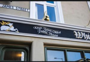 a sign on the side of a building at The White Hart in King's Lynn
