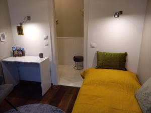 Ένα ή περισσότερα κρεβάτια σε δωμάτιο στο Glam Apartman Miskolc