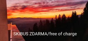 a sunset with the words yakus zarmaarma tree of change at Apartmany Panorama 10X-90X in Štrbské Pleso