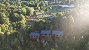 an aerial view of a house in the forest at Cabañas Kalfvgen in Valdivia