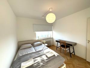 a bedroom with a bed and a desk at SimpleStay Airport in Vantaa