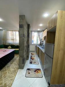 a kitchen with two pizzas on the floor at la paix in Ifrane